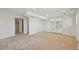Finished basement offers recessed lighting, neutral carpeting, and access to the upper floor at 2243 S Olive St, Denver, CO 80224