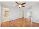 Bright and airy bedroom with hardwood floors and neutral decor at 2243 S Olive St, Denver, CO 80224