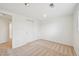 Bedroom featuring neutral carpet, bright white walls, and a double door closet at 2243 S Olive St, Denver, CO 80224