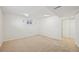 Bedroom features neutral carpet, a closet, and bright white walls at 2243 S Olive St, Denver, CO 80224