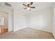 Neutral bedroom featuring wall-to-wall carpeting and closet at 2243 S Olive St, Denver, CO 80224