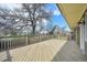 Expansive deck offers ample space for outdoor seating and relaxation, enhanced by lovely landscaping views at 2243 S Olive St, Denver, CO 80224