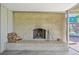 Outdoor brick fireplace with a brick hearth, ready for cozy evenings and outdoor entertaining at 2243 S Olive St, Denver, CO 80224