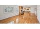 Open kitchen with stainless steel appliances and hardwood floors at 2243 S Olive St, Denver, CO 80224