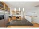 Spacious kitchen with an island, stainless appliances and pendant lighting at 2243 S Olive St, Denver, CO 80224