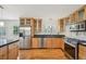 Stylish kitchen featuring stainless steel appliances and granite countertops at 2243 S Olive St, Denver, CO 80224