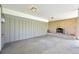 Covered patio area featuring a brick fireplace and access to the backyard, perfect for outdoor gatherings at 2243 S Olive St, Denver, CO 80224