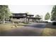 Expansive contemporary home featuring a long driveway and lush natural surroundings at 4852 Isabell Ct, Golden, CO 80403