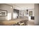 Modern kitchen with stainless steel appliances, a large island, and an adjacent dining area at 4852 Isabell Ct, Golden, CO 80403