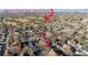 Aerial view of a neighborhood, close to Harvard Gulch Park, boasting mature trees and a variety of home styles at 2626 S Pennsylvania St, Denver, CO 80210