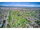 Breathtaking aerial view of a lush park featuring a pond and vibrant green spaces, perfect for outdoor activities at 2626 S Pennsylvania St, Denver, CO 80210
