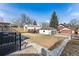 Backyard featuring a detached garage and some bare ground at 2626 S Pennsylvania St, Denver, CO 80210