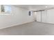 Spacious basement with neutral carpet, recessed lighting, and bright windows at 2626 S Pennsylvania St, Denver, CO 80210