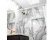 Stylish bathroom with marble-look shower and updated vanity at 2626 S Pennsylvania St, Denver, CO 80210