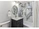 Stylish bathroom with marble-look shower and updated vanity at 2626 S Pennsylvania St, Denver, CO 80210
