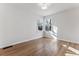 Cozy bedroom features gleaming hardwood floors and abundant natural light at 2626 S Pennsylvania St, Denver, CO 80210