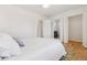 Bright bedroom features hardwood floors and white walls, creating a clean and inviting space at 2626 S Pennsylvania St, Denver, CO 80210