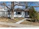 Charming home featuring tidy landscaping and a sidewalk leading to the front door at 2626 S Pennsylvania St, Denver, CO 80210