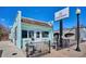 Unique ice cream shop with a bright, inviting exterior, picnic tables, and a large signage at 2626 S Pennsylvania St, Denver, CO 80210
