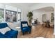Comfortable living area with natural light, stylish seating, and hardwood floors at 2626 S Pennsylvania St, Denver, CO 80210