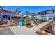 Inviting outdoor seating with a welcome sign, lush landscaping, and ample space for guests to relax at 2626 S Pennsylvania St, Denver, CO 80210