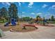 A colorful and inviting playground with slides, climbing structures, and picnic tables for Gathering fun at 2626 S Pennsylvania St, Denver, CO 80210