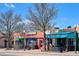 Charming shops line the street with colorful storefronts and awnings for a delightful local experience at 2626 S Pennsylvania St, Denver, CO 80210