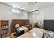 Basement featuring a piano and natural light from the windows at 25 S Winona Ct, Denver, CO 80219