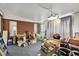 Spacious unfinished basement area presents opportunity for storage or renovation with natural light and brick wall feature at 25 S Winona Ct, Denver, CO 80219