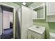Functional bathroom with a shower, vanity, and mirror; clean and efficient design at 25 S Winona Ct, Denver, CO 80219