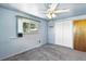 Bright bedroom with a window view, closet, and a ceiling fan, offering comfort and functionality at 25 S Winona Ct, Denver, CO 80219