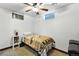 Basement bedroom featuring natural light from 3 windows, carpet, and fan light at 25 S Winona Ct, Denver, CO 80219