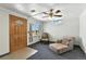 Relaxing living room with carpet, plenty of natural light, ceiling fan, and a classic wood entry door at 25 S Winona Ct, Denver, CO 80219