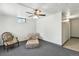 Cozy living room with carpet, and a ceiling fan with an accent chair at 25 S Winona Ct, Denver, CO 80219