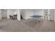 Spacious basement area perfect for recreation, complete with a ping pong table and stairs at 8884 Miners St, Highlands Ranch, CO 80126