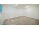 Unfurnished basement area featuring neutral carpet and a door to other rooms at 8884 Miners St, Highlands Ranch, CO 80126