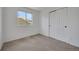 Cozy bedroom featuring a window for natural light and a closet for storage at 8884 Miners St, Highlands Ranch, CO 80126