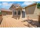 Wood deck extending from the side of a home with a sliding door at 8884 Miners St, Highlands Ranch, CO 80126