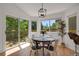 Bright dining area with a modern light fixture and an outdoor view at 8884 Miners St, Highlands Ranch, CO 80126