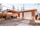 Secluded backyard patio with pergola and outdoor dining area, ideal for entertaining guests at 2335 Stout St, Denver, CO 80205