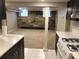 Finished basement space featuring stone accent wall, neutral carpeting, and natural light at 2335 Stout St, Denver, CO 80205