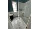 Bathroom featuring tub with a shower, sleek fixtures, and clean aesthetic at 2335 Stout St, Denver, CO 80205