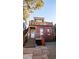 Charming exterior elevation of home with a private rooftop deck and stairway access at 2335 Stout St, Denver, CO 80205
