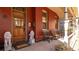 Inviting covered front porch with elegant lion statues, wooden door, and comfortable seating area at 2335 Stout St, Denver, CO 80205