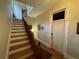 Classic foyer with hardwood floors, staircase, and decorative trim detailing throughout at 2335 Stout St, Denver, CO 80205