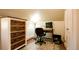 Home office featuring a wooden desk, comfortable chair, stylish dresser, and natural light at 2335 Stout St, Denver, CO 80205
