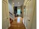 Hallway view towards modern kitchen, showcasing the beautiful hardwood flooring at 2335 Stout St, Denver, CO 80205