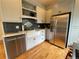 Well-appointed kitchen with stainless steel appliances, granite counters, and modern cabinetry at 2335 Stout St, Denver, CO 80205