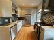 Modern kitchen with stainless steel appliances, stylish cabinetry and wood flooring at 2335 Stout St, Denver, CO 80205