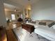 Bright living space featuring hardwood floors, an area rug, and comfortable white furniture with decorative pillows at 2335 Stout St, Denver, CO 80205